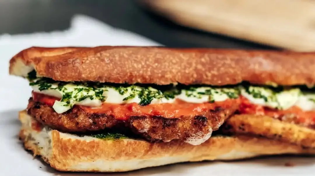 The Triple “P”: a breaded chicken cutlet with vodka sauce, fresh mozzarella and basil pesto on a toasted roll
